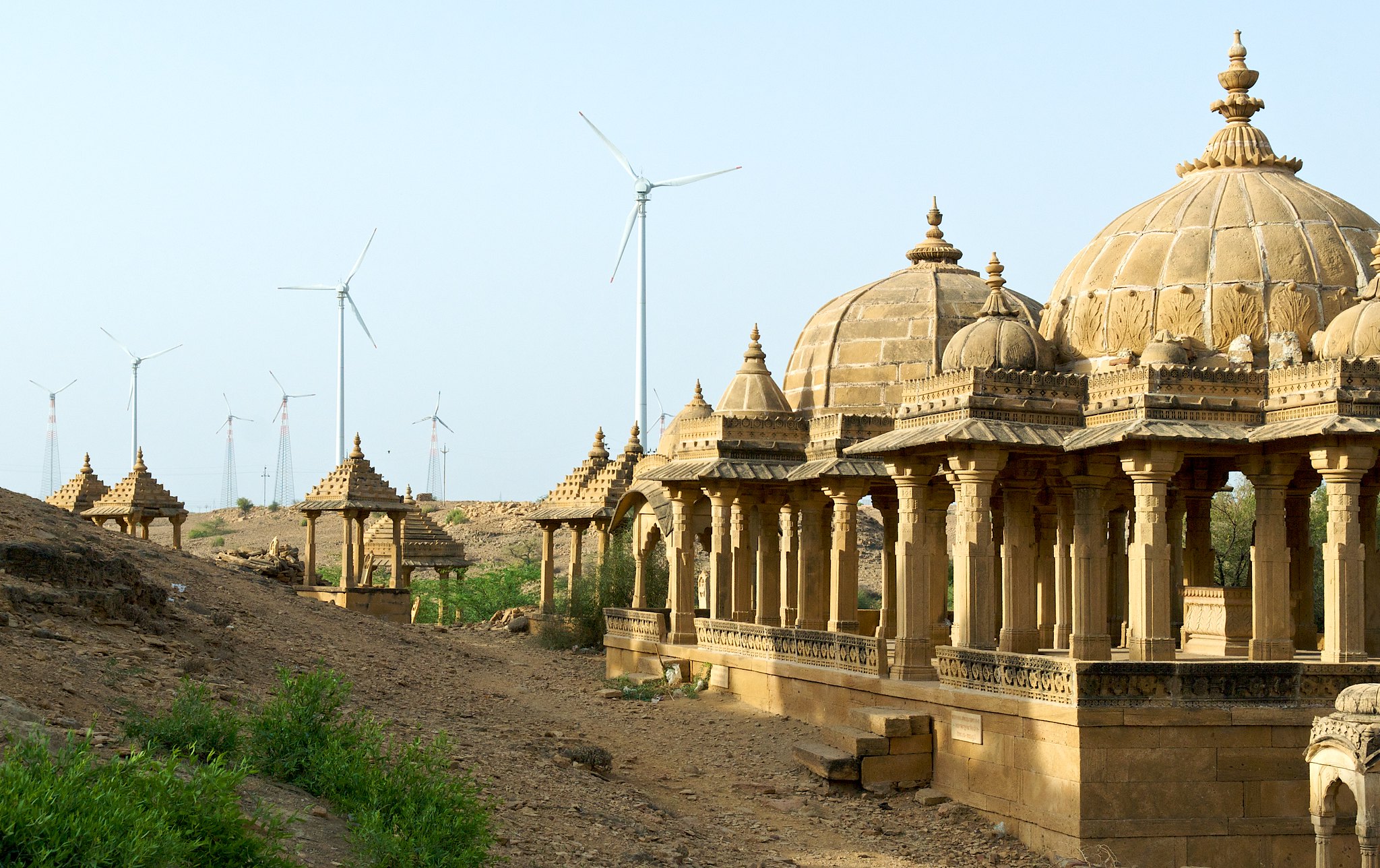 wind turbines in background of historic site in Jaisalmer, Rajasthan
